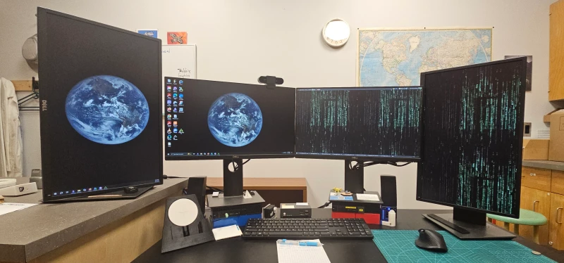 Physics and computer science work are split across two separate physical networks here, with Windows handling university coursework and Linux managing CS work on the right. Synergy replaced a KVM that made switching painful, and now copy-pasting between the two machines is straightforward.