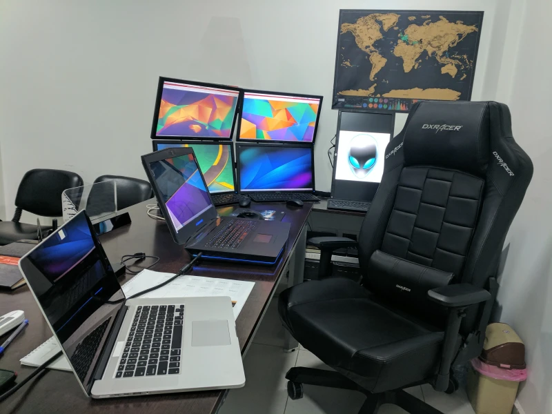 Controlling a MacBook, a gaming laptop, and an Alienware desktop from one mouse and keyboard is what Synergy handles here. The Alienware acts as the hub, keeping everything reachable without switching inputs between machines.
