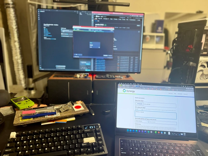 Switching between macOS for lighter work and Windows for heavier tasks is the whole point here. Synergy keeps one keyboard and mouse shared across both machines, so the pivot between platforms is just a cursor move, no peripheral swapping involved.