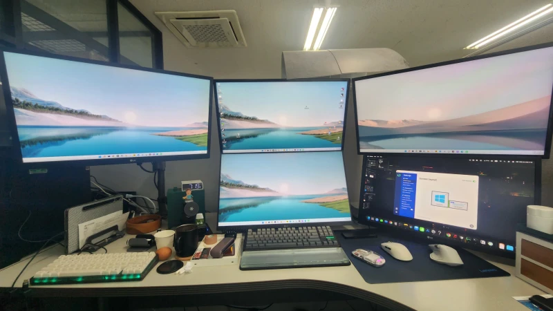 Ten years with Synergy, from version 1 through to 3, and this setup keeps growing. The Mac Mini in the bottom right runs as the master server, with its mouse and keyboard reaching across four Windows machines.