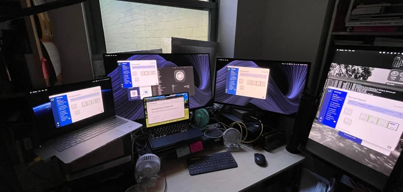 One keyboard and mouse covers four MacBook Airs at the desk full time, with Linux laptops joining the Synergy layout on demand whenever they come home from being carried around. Plugging in activates sharing instantly, no input switching needed.