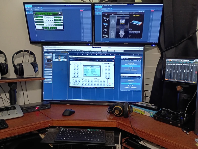 Three Windows PCs share the music production workload here, connected through Vienna Symphonic Library with Synergy tying all three together under one keyboard and mouse.