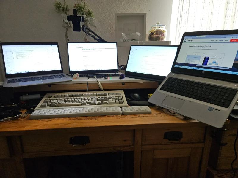 Running three separate machines for employment, self-employment, and security testing, but fitting all of it onto a 120 x 60 cm desk means only two run in parallel at a time, with HDMI switches handling the middle displays.