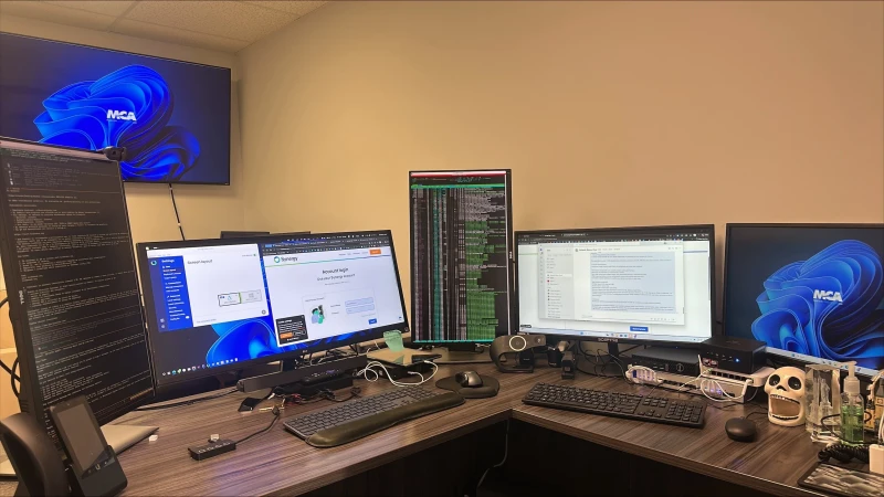 GNU/Linux Ubuntu on the primary machine, Windows 11 Enterprise on the secondary, one keyboard and mouse sliding between them. The Synergy login screen is already up, ready to tie the two systems together so work can move between operating systems without touching a second input device.