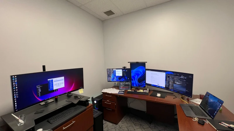 Research work at Vanderbilt University runs across four computers and both Mac and Windows, all tied together by Synergy. The setup has been running this way since 2015, with one keyboard and mouse moving between machines so the science, not the hardware, stays in focus.
