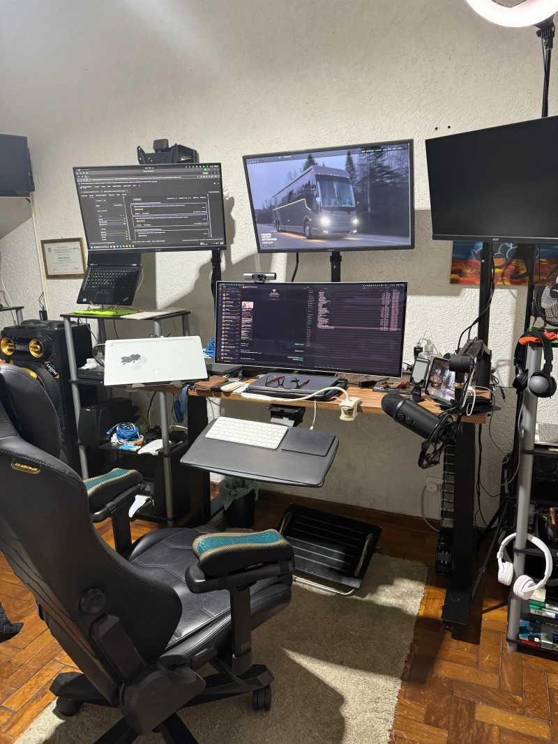Three computers, each with a dedicated purpose, share this desk and one set of peripherals. Synergy keeps the mouse and keyboard moving between all three without any switching hardware, so each machine stays ready for whatever role it fills.